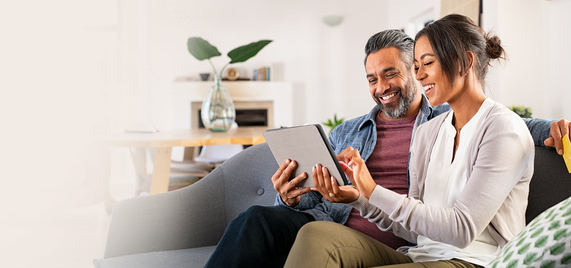 couple smiling on couch
